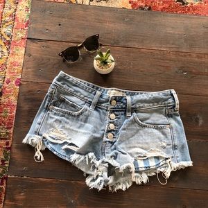 Low rise distressed jean shorts